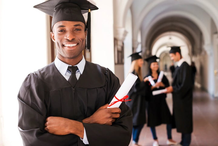 college graduate holding his diploma | Tindol Subaru in Gastonia NC